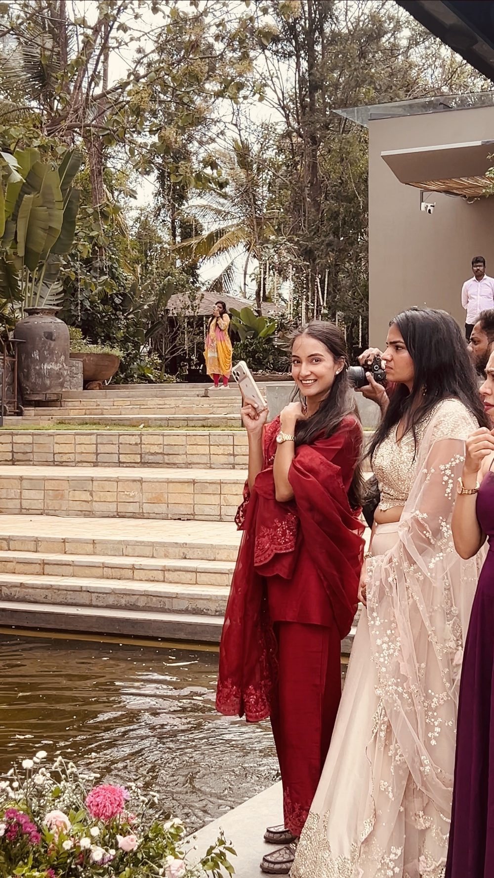 radhika filming quietly among the guests