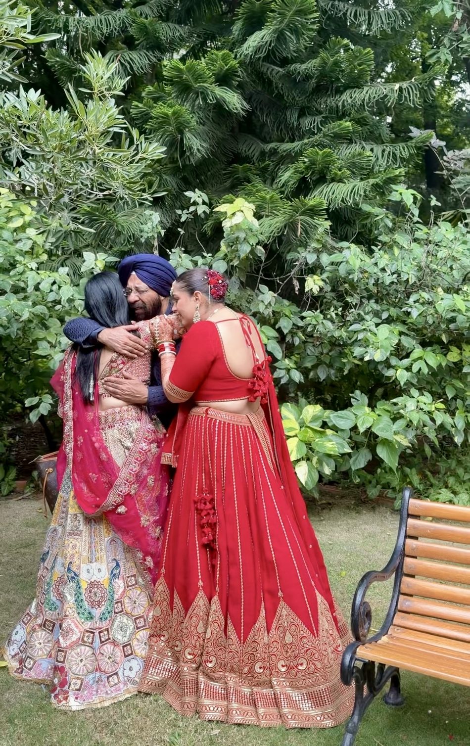 a bride held by her parents